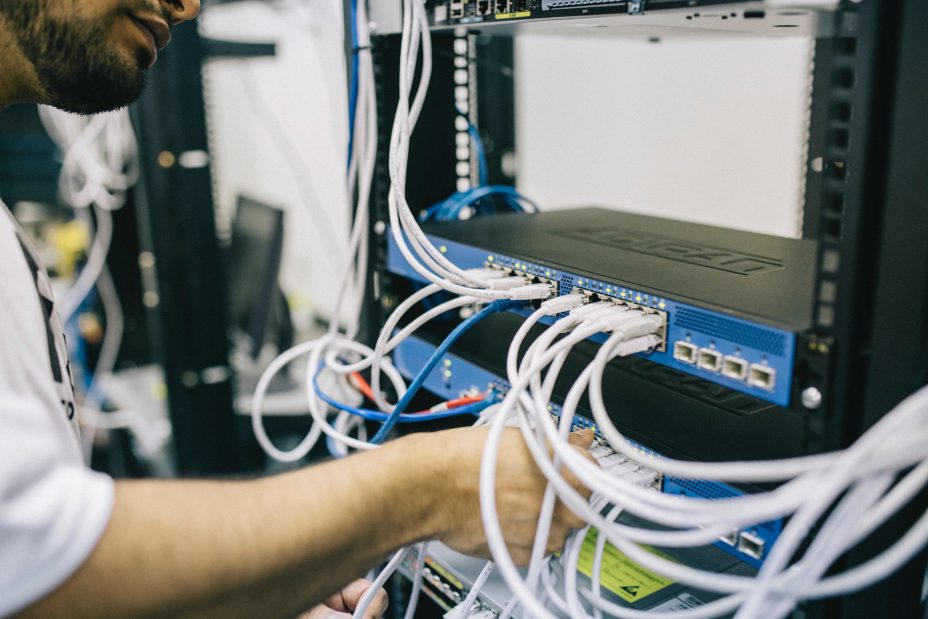 improve site speed by improving server response time
Image: picture of man adjusting cables in a computer server